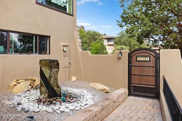 a view of a balcony with chair and wooden floor