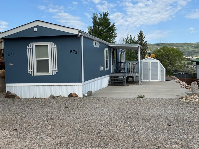 972 Ridgeway Loop, Unit 228 Garden City, UT 84028 - Photo 2 of 26 View of front facade featuring a storage shed