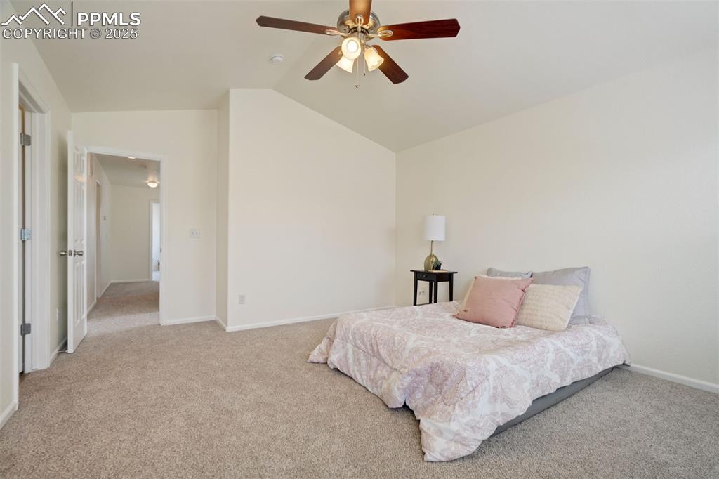 7536 Sandy Springs Point Fountain, CO 80817 - Photo 19 of 38 a bedroom with a bed and window