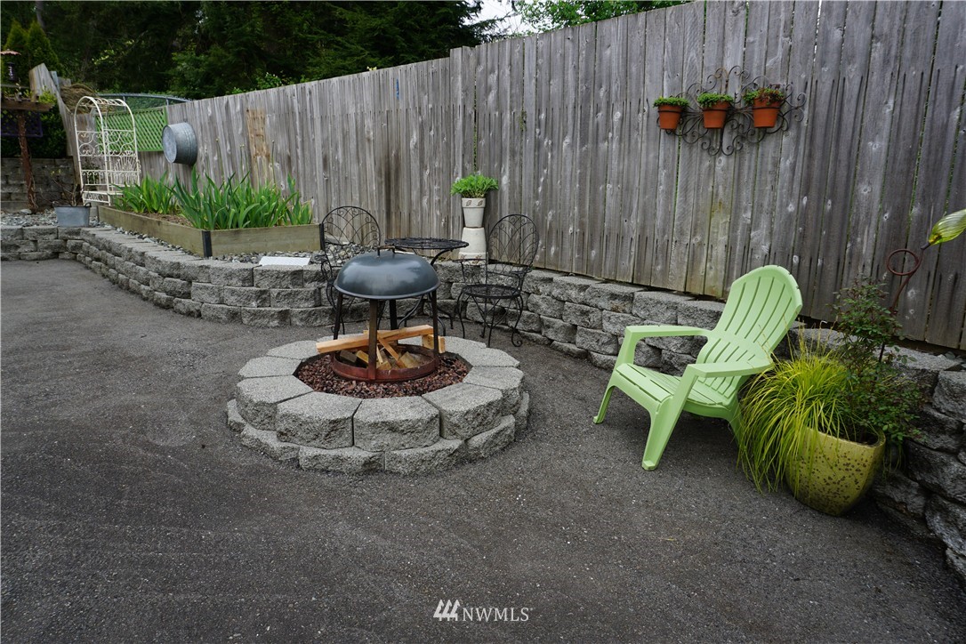 17813 Butler Road Snohomish, WA 98290 - Photo 13 of 23 a view of a backyard with furniture and a slide