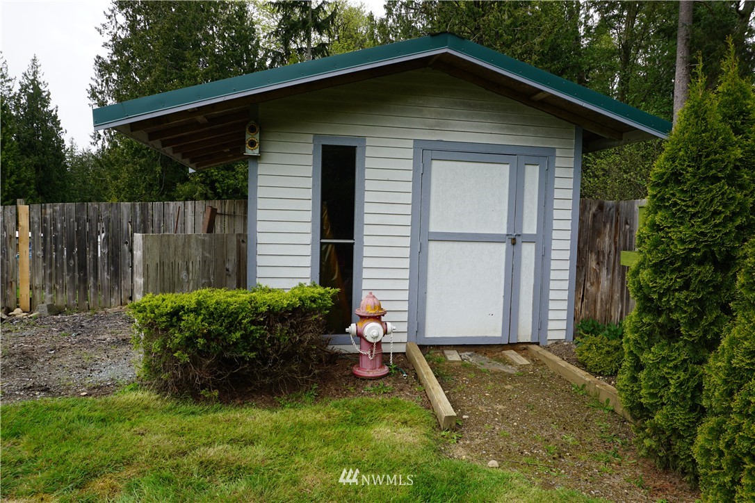 17813 Butler Road Snohomish, WA 98290 - Photo 20 of 23 a house with a small yard plants and large trees