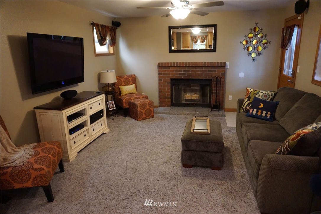 17813 Butler Road Snohomish, WA 98290 - Photo 5 of 23 a living room with furniture and a flat screen tv