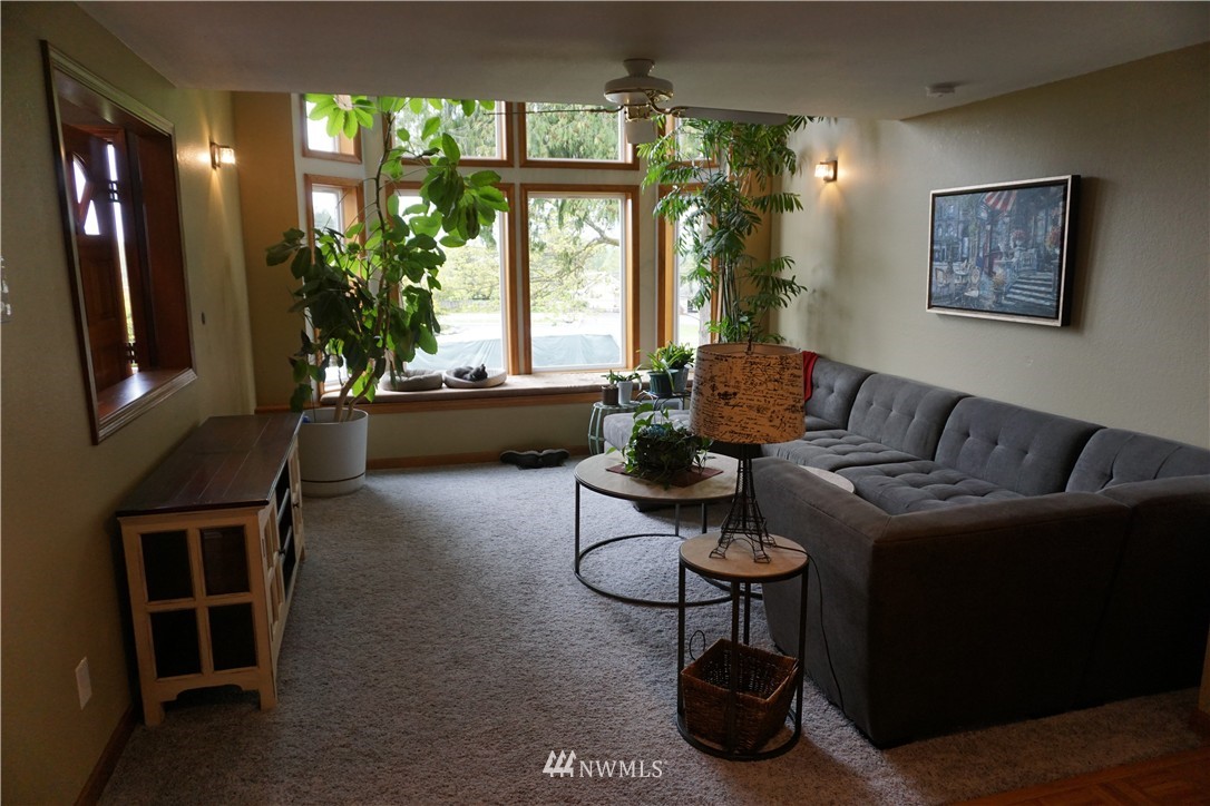 17813 Butler Road Snohomish, WA 98290 - Photo 6 of 23 a living room with furniture rug and window