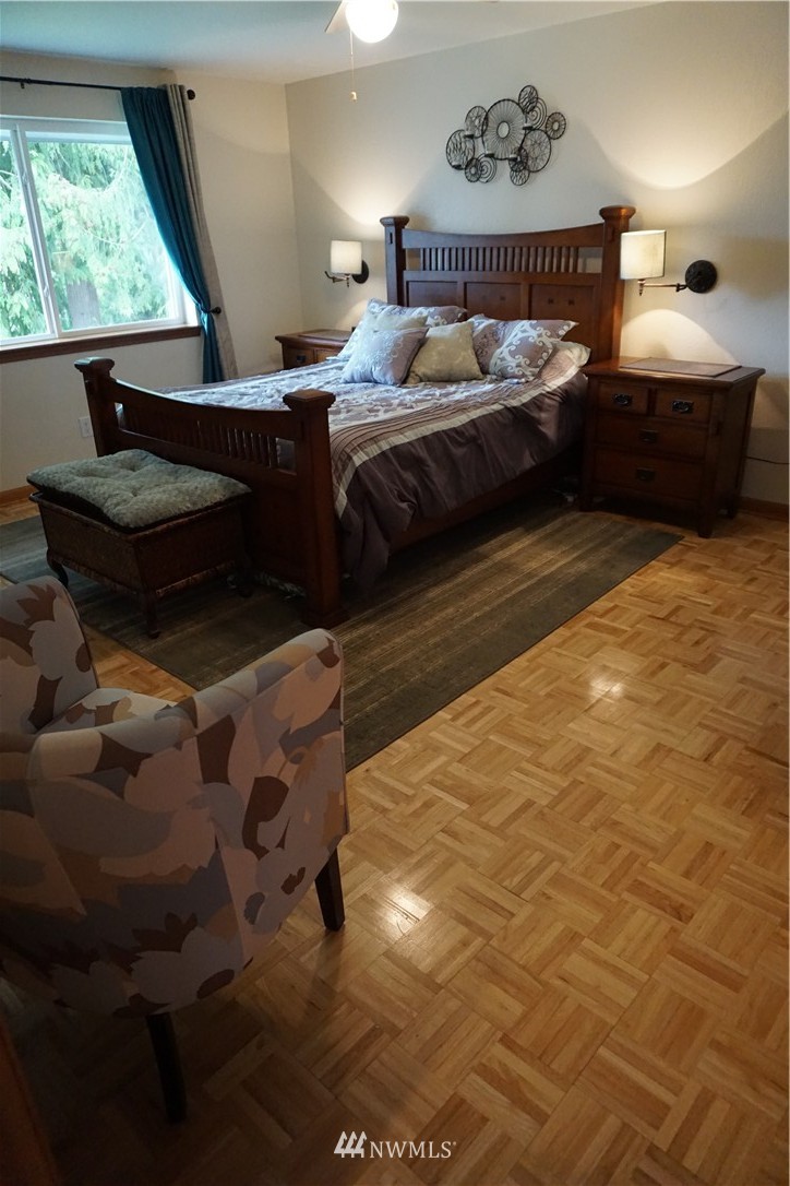 17813 Butler Road Snohomish, WA 98290 - Photo 8 of 23 a bedroom with a bed and window