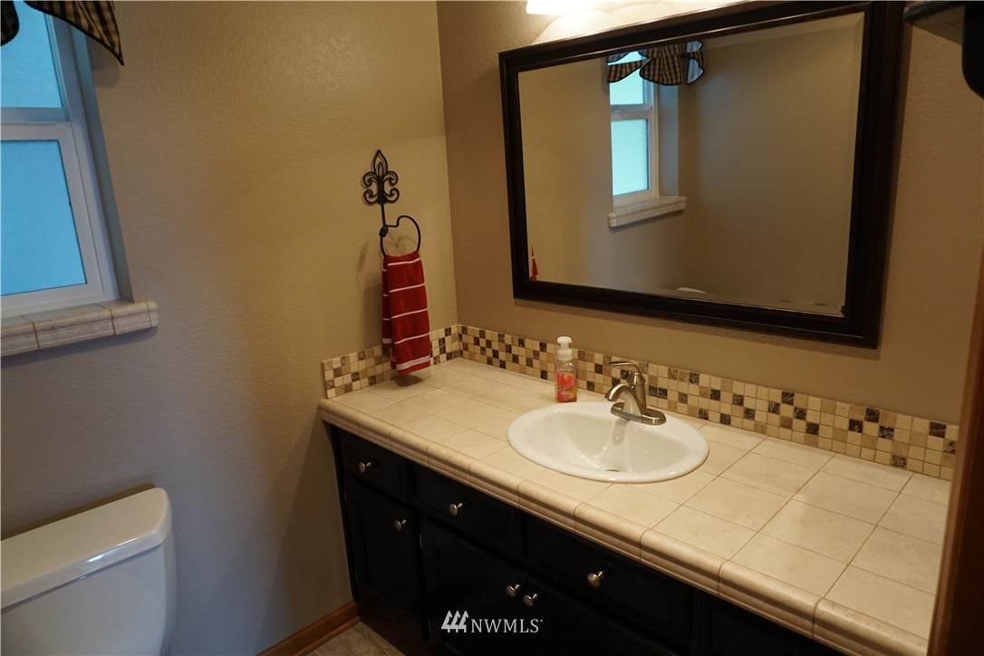 17813 Butler Road Snohomish, WA 98290 - Photo 10 of 23 a bathroom with a sink and a mirror