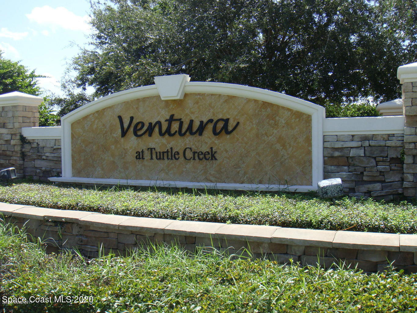 3848 Lexmark Lane, Unit 401 Rockledge, FL 32955 - Photo 20 of 23 a view of outdoor space with signage and flags