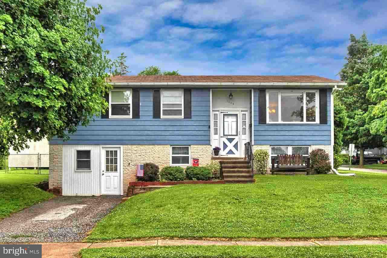 1409 Wogan Road York, PA 17404 - Photo 1 of 36 a front view of a house with a yard