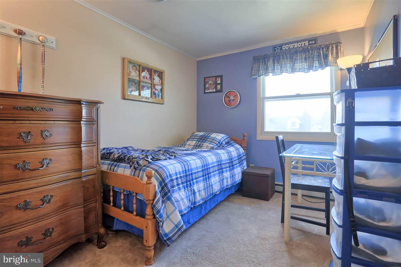1409 Wogan Road York, PA 17404 - Photo 16 of 36 a bedroom with a bed and a window