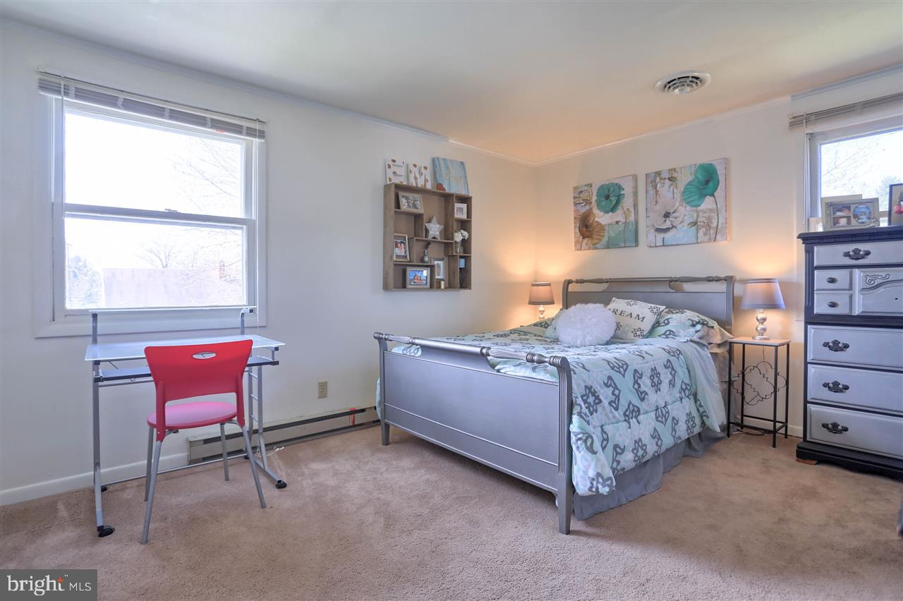 1409 Wogan Road York, PA 17404 - Photo 20 of 36 a bedroom with a bed and a window