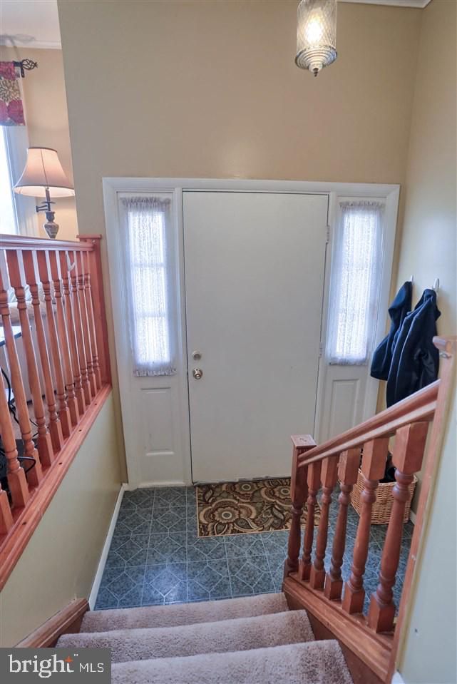 1409 Wogan Road York, PA 17404 - Photo 3 of 36 a view of stairs and bedroom with wooden floor