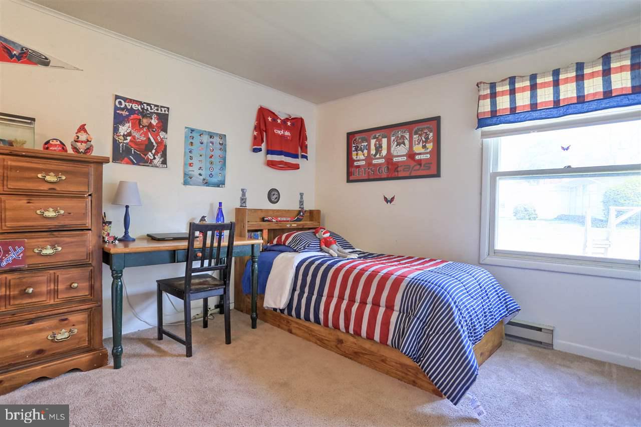 1409 Wogan Road York, PA 17404 - Photo 23 of 36 a bedroom with a bed and furniture