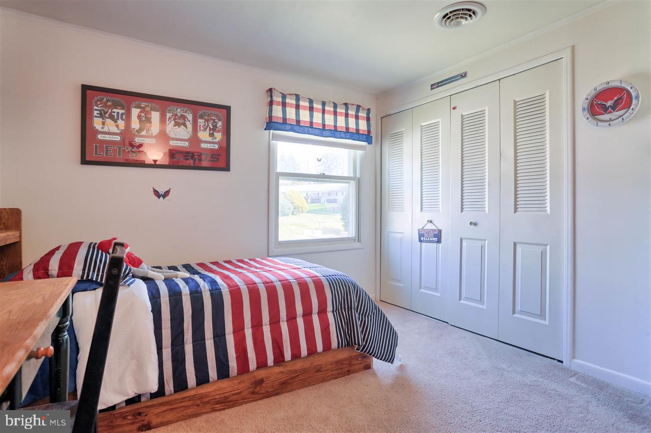 1409 Wogan Road York, PA 17404 - Photo 24 of 36 a bed sitting in a bedroom next to a window
