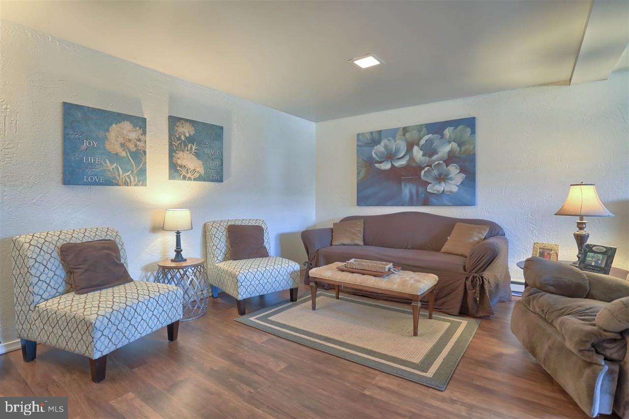 1409 Wogan Road York, PA 17404 - Photo 25 of 36 a living room with furniture and a night stand