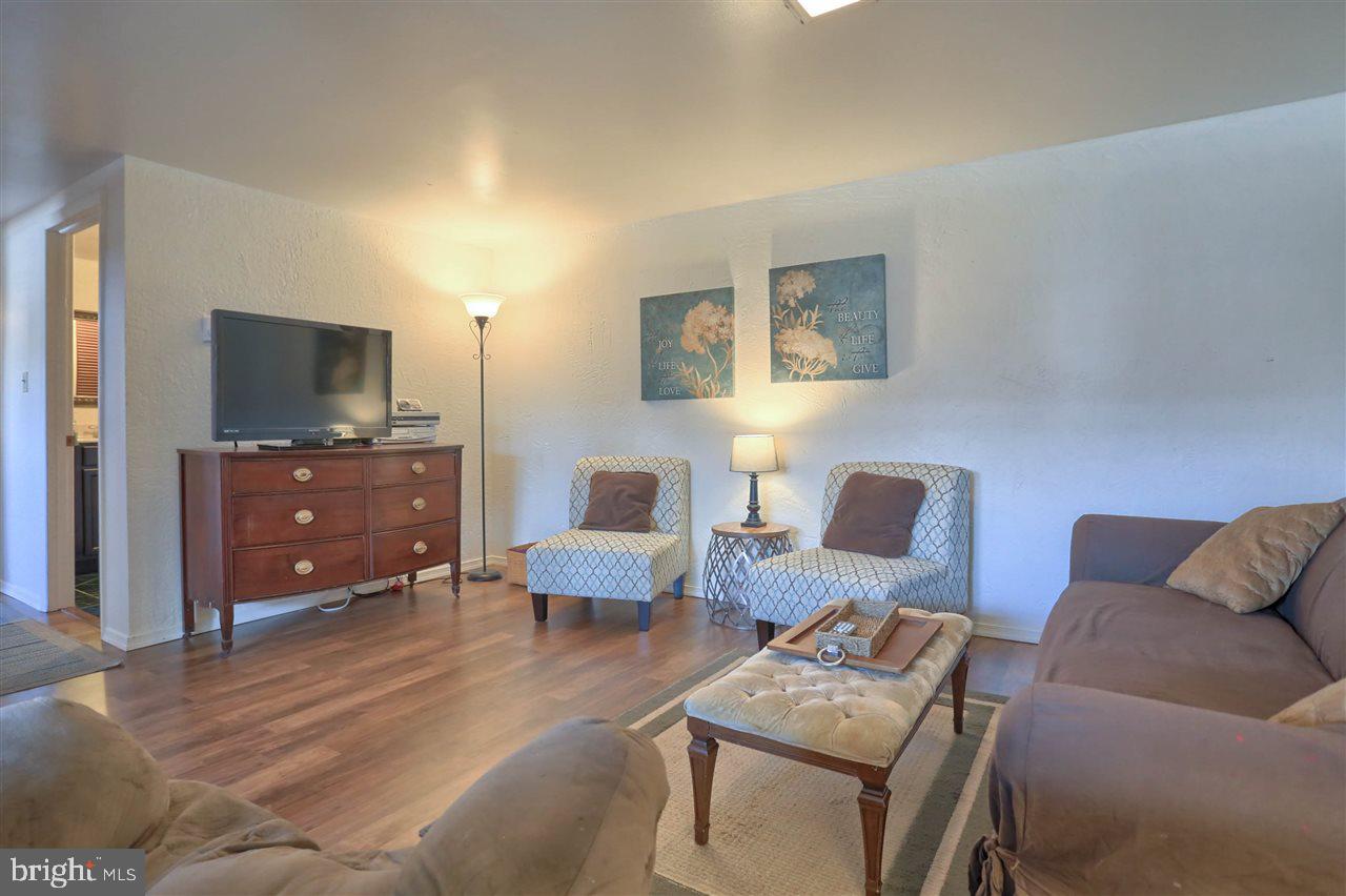 1409 Wogan Road York, PA 17404 - Photo 28 of 36 a living room with furniture and a flat screen tv