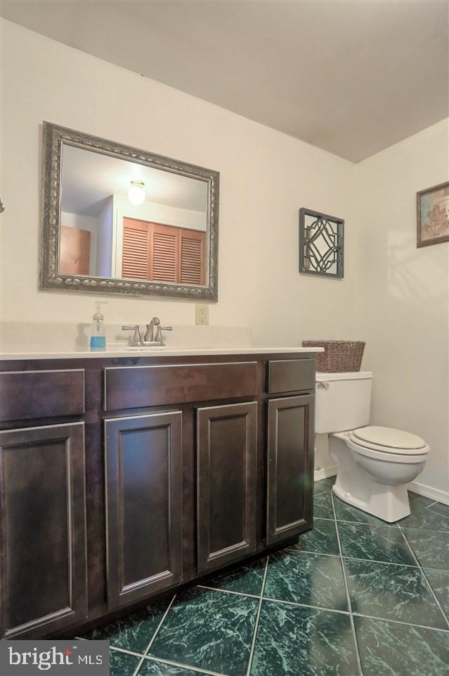 1409 Wogan Road York, PA 17404 - Photo 30 of 36 a bathroom with a toilet a sink and mirror