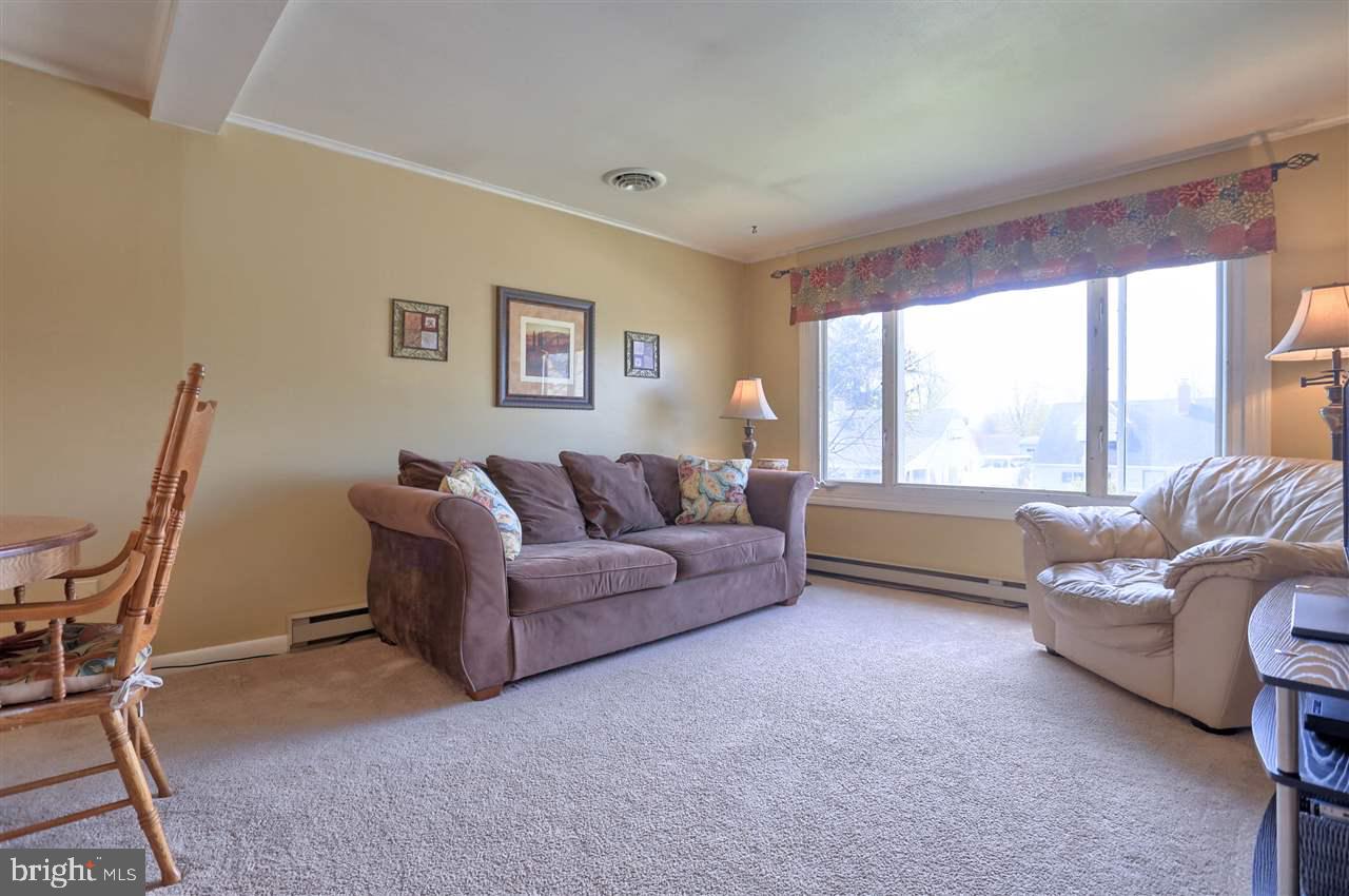 1409 Wogan Road York, PA 17404 - Photo 4 of 36 a living room with furniture and a large window