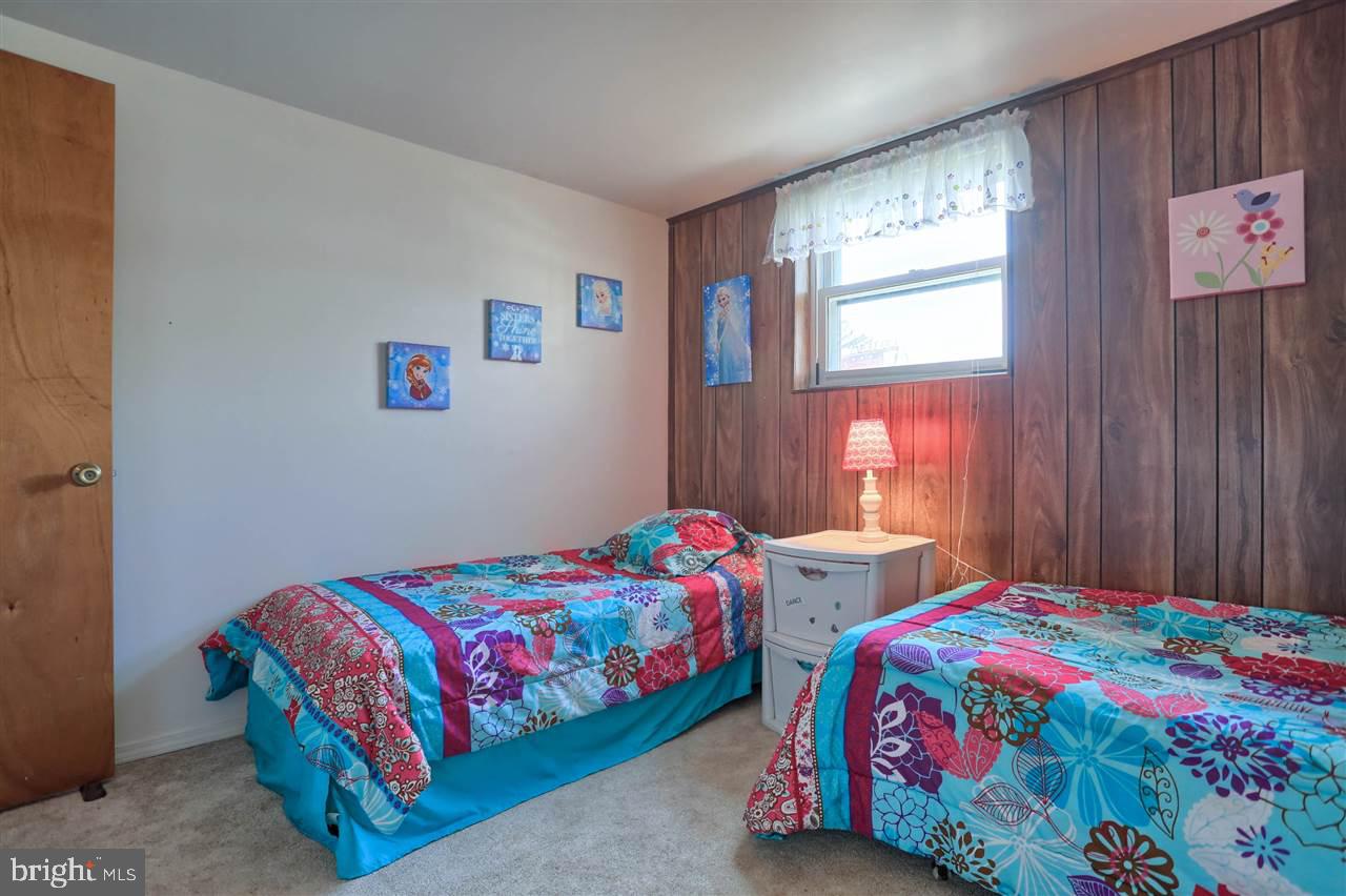 1409 Wogan Road York, PA 17404 - Photo 32 of 36 a bedroom with a bed and a window
