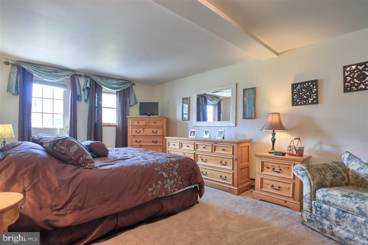 1409 Wogan Road York, PA 17404 - Photo 35 of 36 a bedroom with a bed and dresser