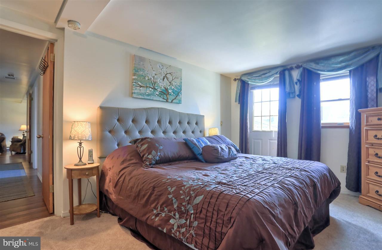 1409 Wogan Road York, PA 17404 - Photo 36 of 36 a bedroom with a large bed and a window