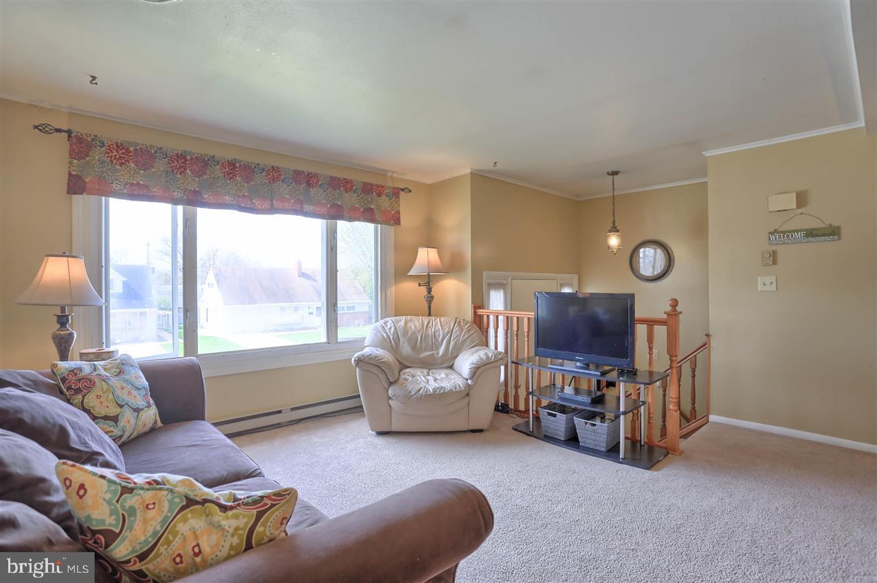 1409 Wogan Road York, PA 17404 - Photo 5 of 36 a living room with furniture and a large window