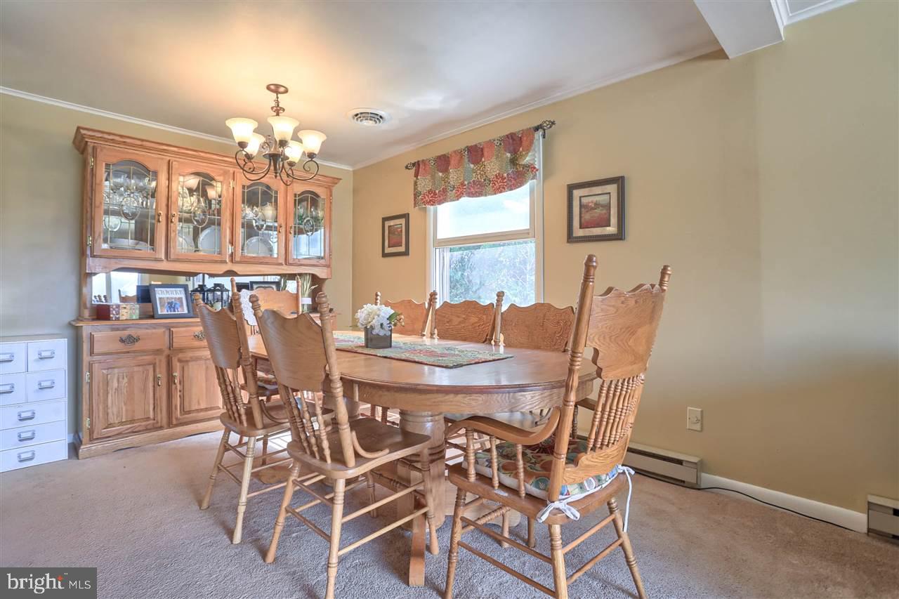 1409 Wogan Road York, PA 17404 - Photo 8 of 36 a view of a dining room with furniture and chandelier