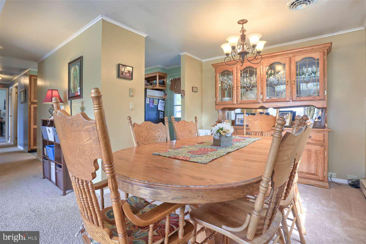 1409 Wogan Road York, PA 17404 - Photo 9 of 36 a view of a dining room with furniture and a chandelier