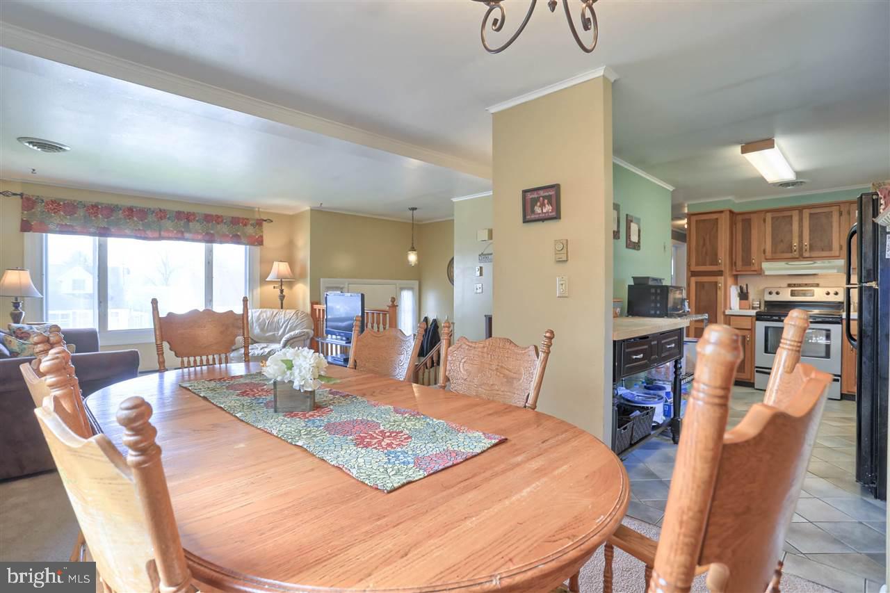 1409 Wogan Road York, PA 17404 - Photo 10 of 36 a large kitchen with a table and chairs