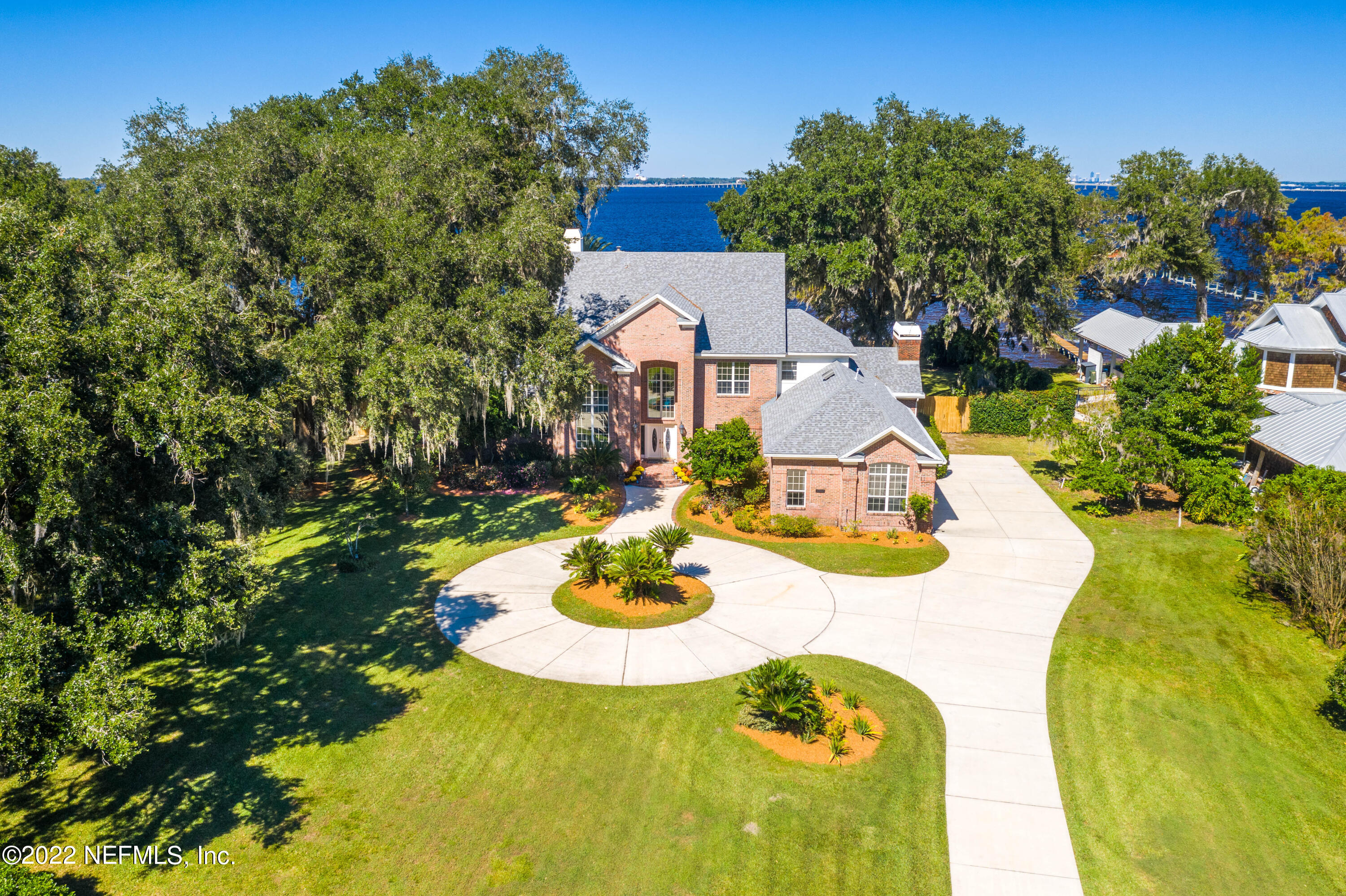 12608 Mandarin Road Jacksonville, FL 32223 - Photo 1 of 55 a view of a house with swimming pool lawn chairs and a fire pit