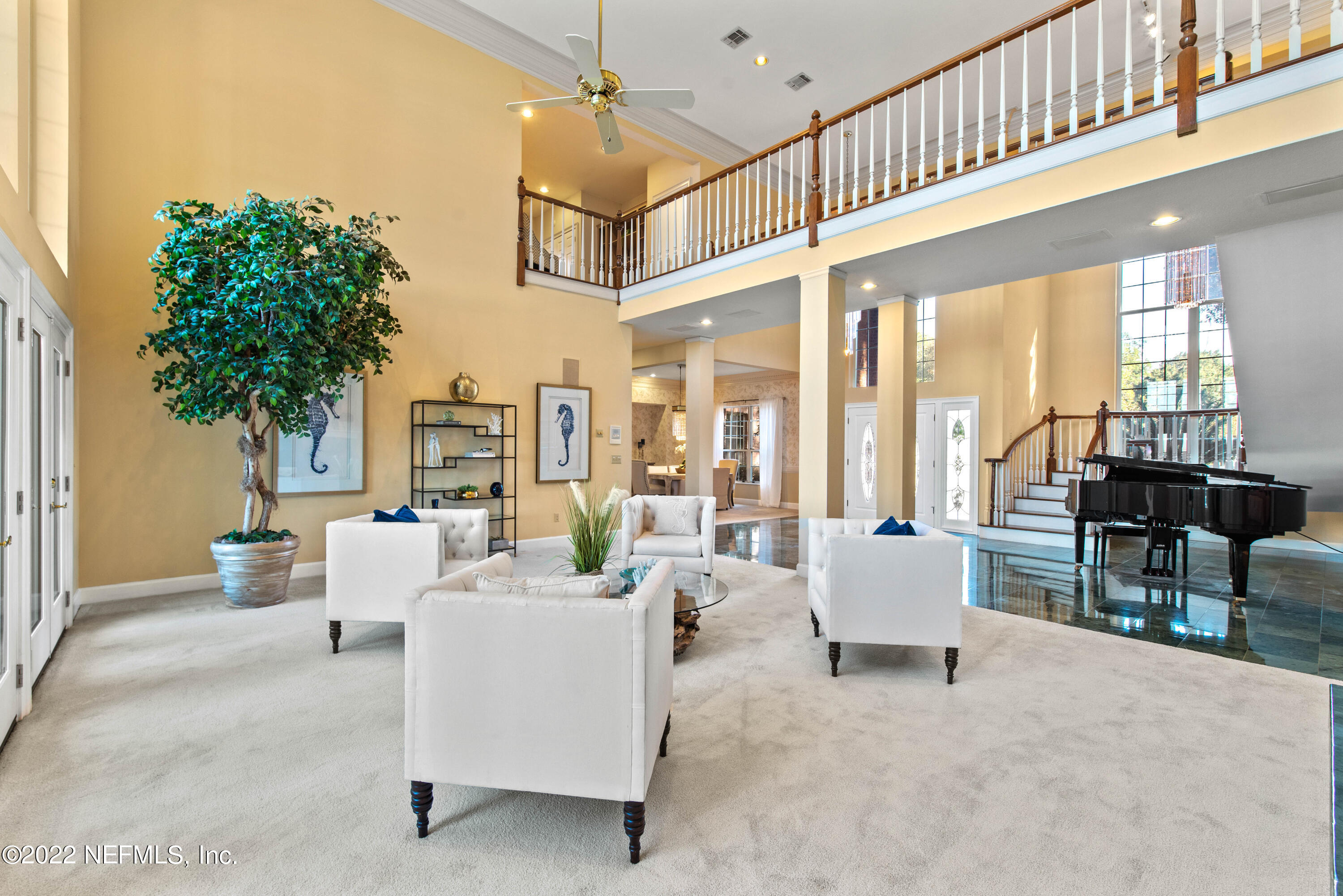 12608 Mandarin Road Jacksonville, FL 32223 - Photo 11 of 55 a living room with furniture and large windows