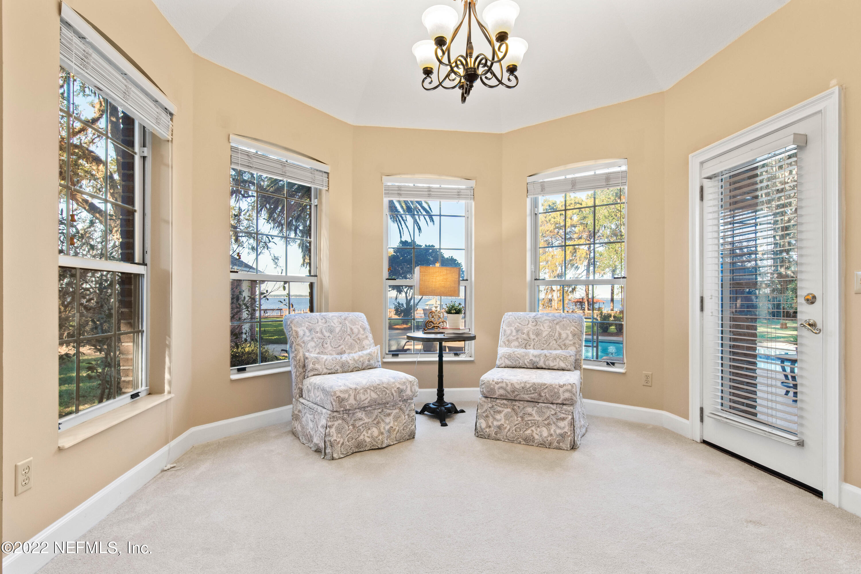 12608 Mandarin Road Jacksonville, FL 32223 - Photo 14 of 55 a living room with furniture and a large window