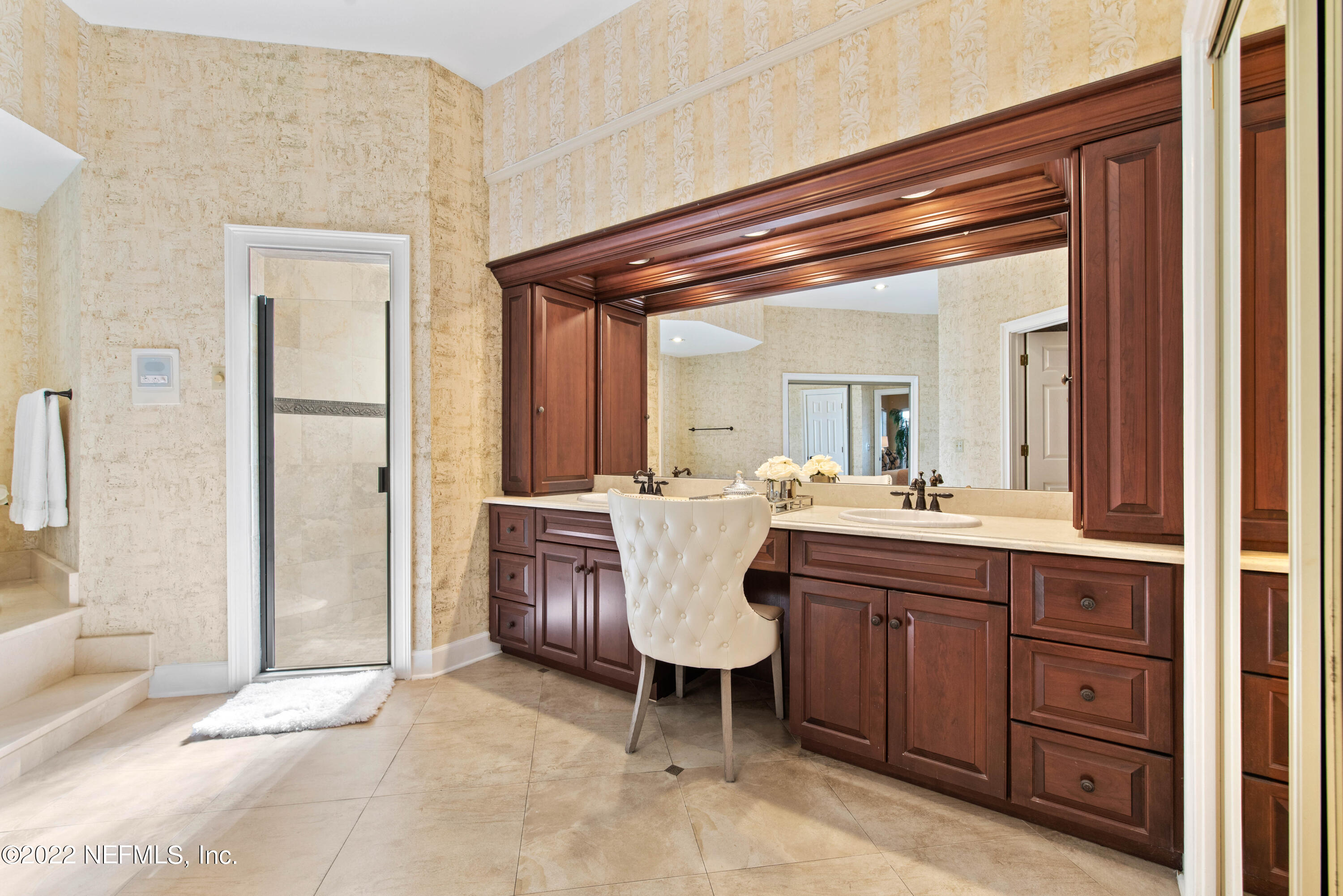12608 Mandarin Road Jacksonville, FL 32223 - Photo 16 of 55 a bathroom with a sink and a mirror