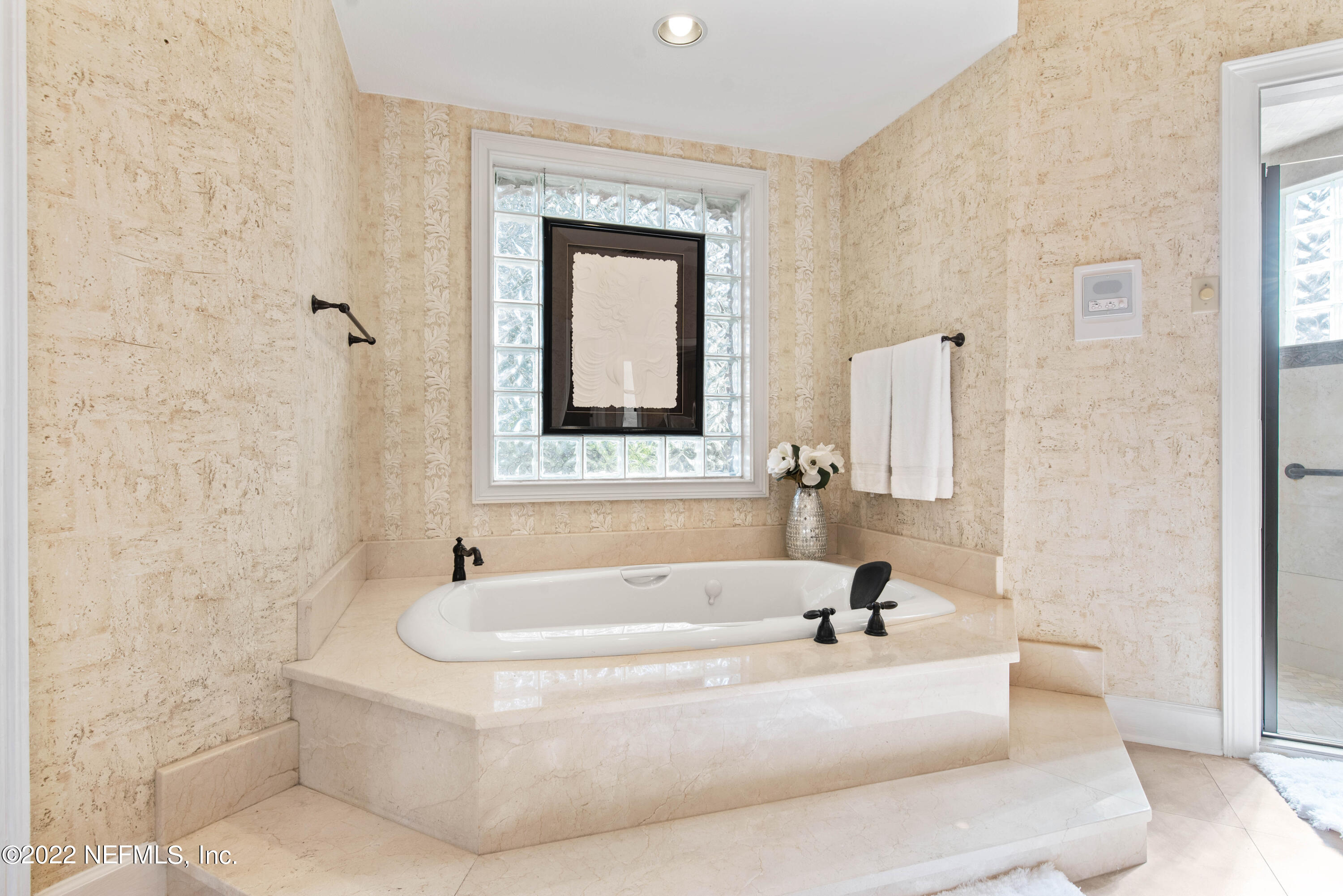 12608 Mandarin Road Jacksonville, FL 32223 - Photo 17 of 55 a white bath tub sitting in a bathroom