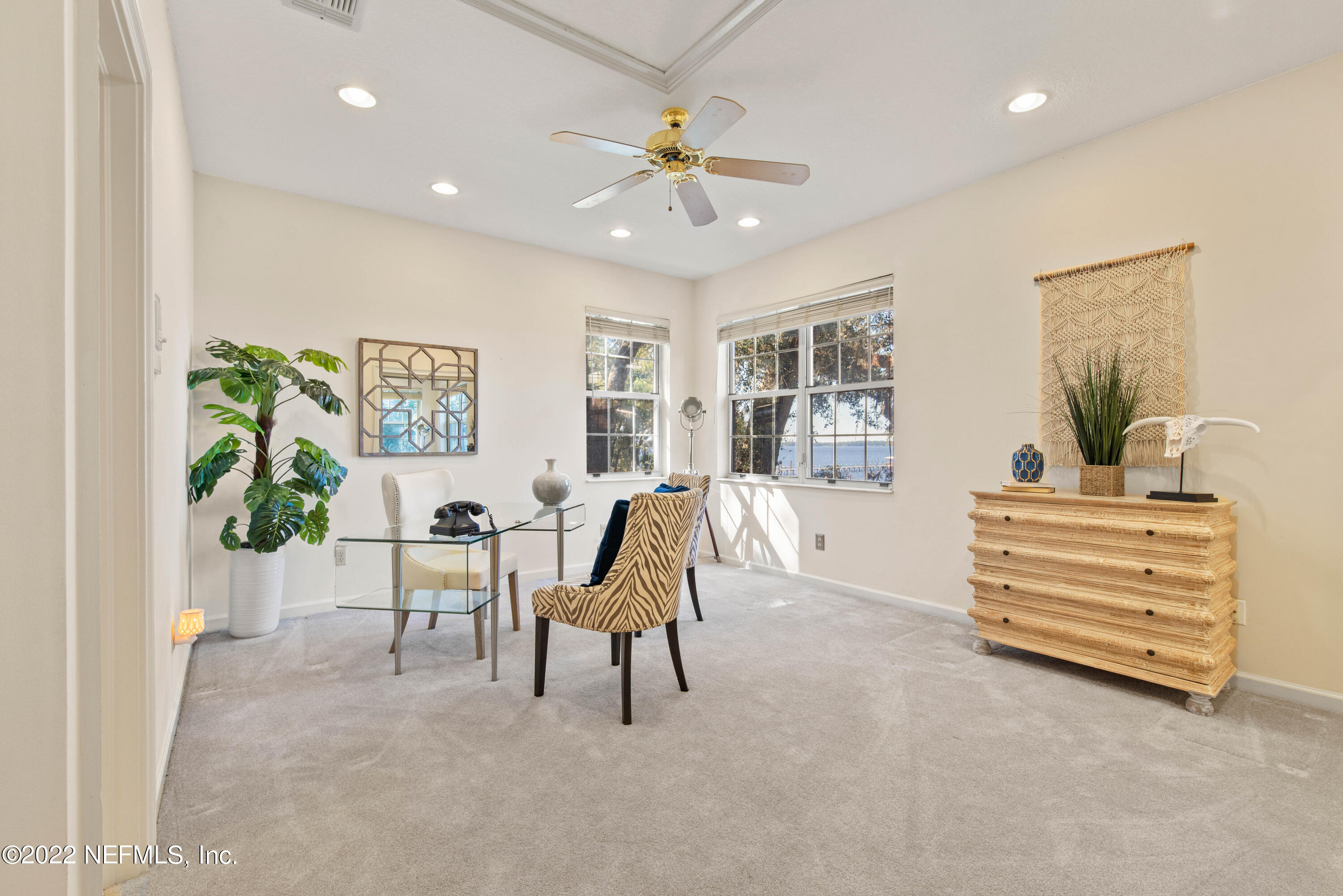 12608 Mandarin Road Jacksonville, FL 32223 - Photo 29 of 55 a living room with furniture and a chandelier