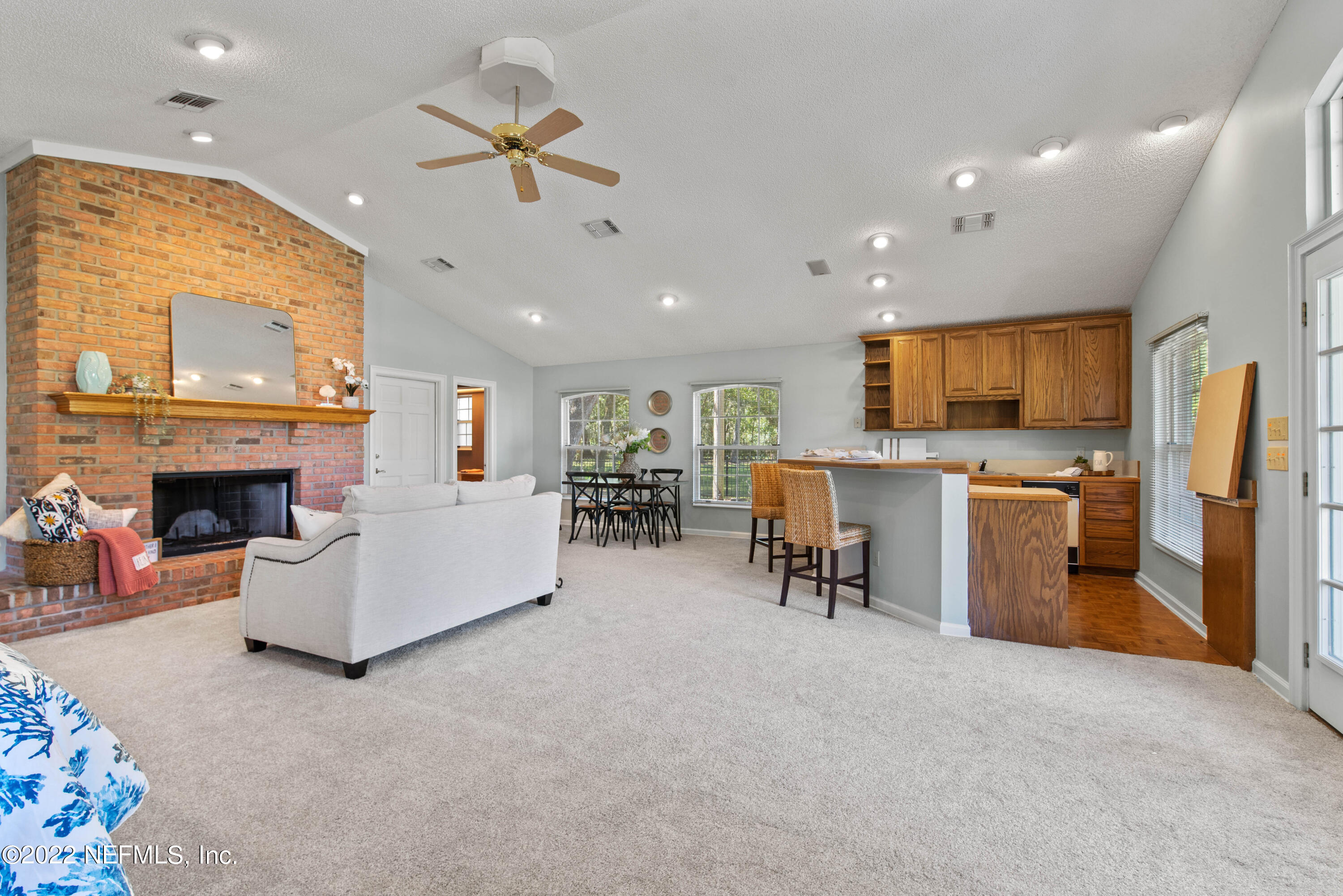 12608 Mandarin Road Jacksonville, FL 32223 - Photo 45 of 55 a living room with furniture and a fireplace