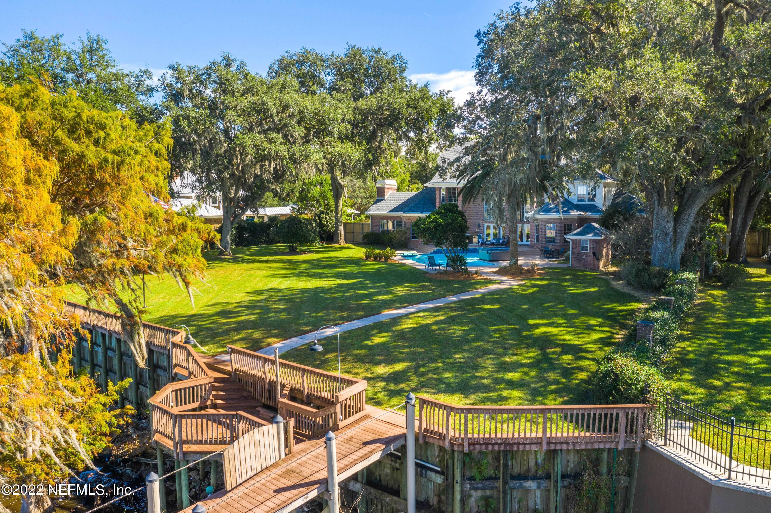 12608 Mandarin Road Jacksonville, FL 32223 - Photo 51 of 55 a view of a yard with plants and large trees