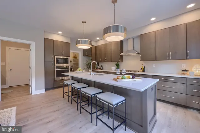 a kitchen with a sink cabinets and window