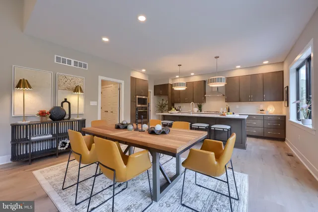 a kitchen with a table and chairs in it