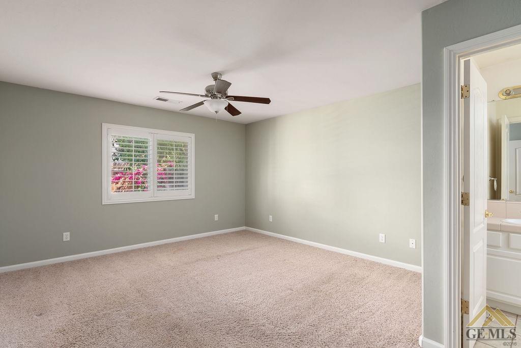 Undisclosed Address Bakersfield, CA 93312 - Photo 11 of 28 a view of an empty room with a window