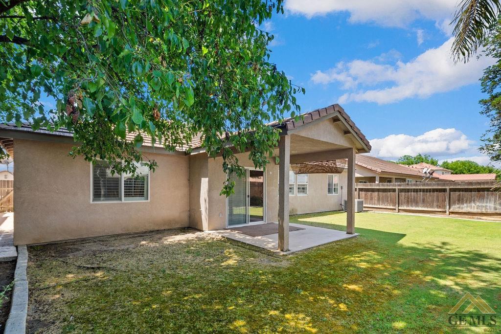 Undisclosed Address Bakersfield, CA 93312 - Photo 19 of 28 a house view with a swimming pool