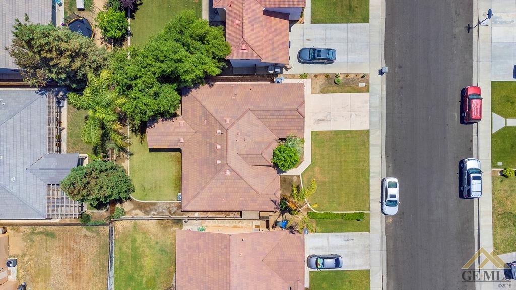Undisclosed Address Bakersfield, CA 93312 - Photo 20 of 28 an aerial view of residential house with outdoor space and swimming pool