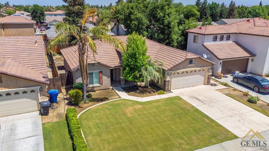 Undisclosed Address Bakersfield, CA 93312 - Photo 21 of 28 a view of a house with pool and chairs