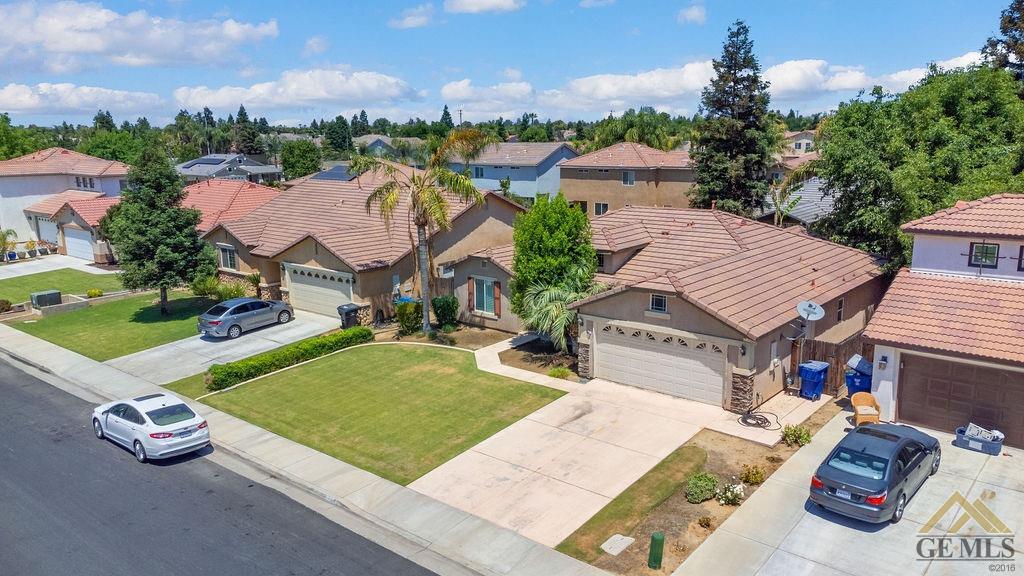 Undisclosed Address Bakersfield, CA 93312 - Photo 23 of 28 an aerial view of a house with garden space and street view