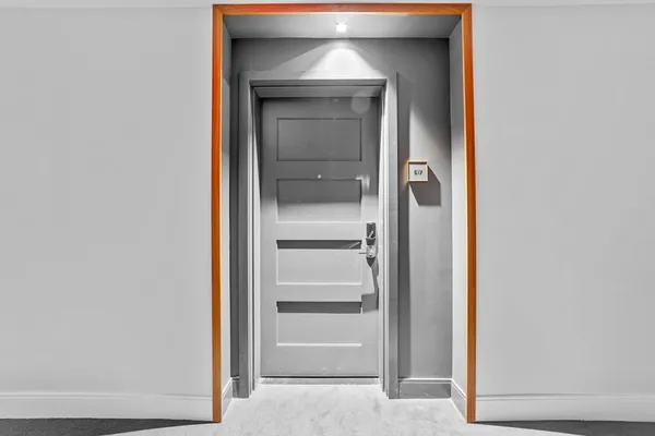 a view of an empty room and closet area