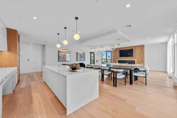 a view of kitchen with cabinets and wooden floor