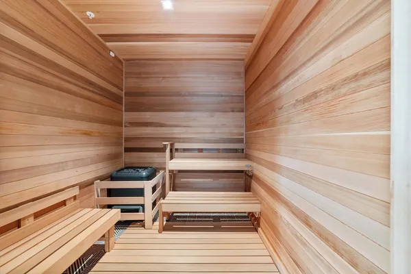 a view of a hallway with living room and furniture