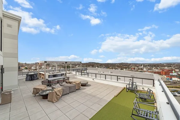 a view of a patio with swimming pool table and chairs