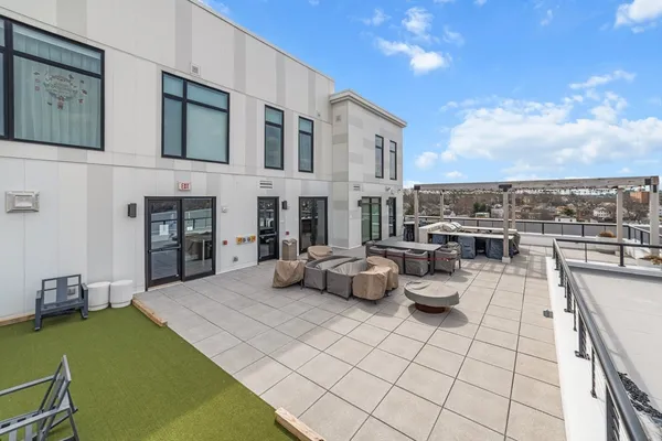 a lobby with furniture and a floor to ceiling window