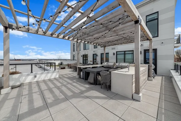 a view of outdoor space with seating area and barbeque oven