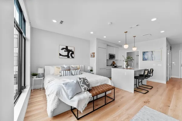 a view of a dining room with furniture and wooden floor