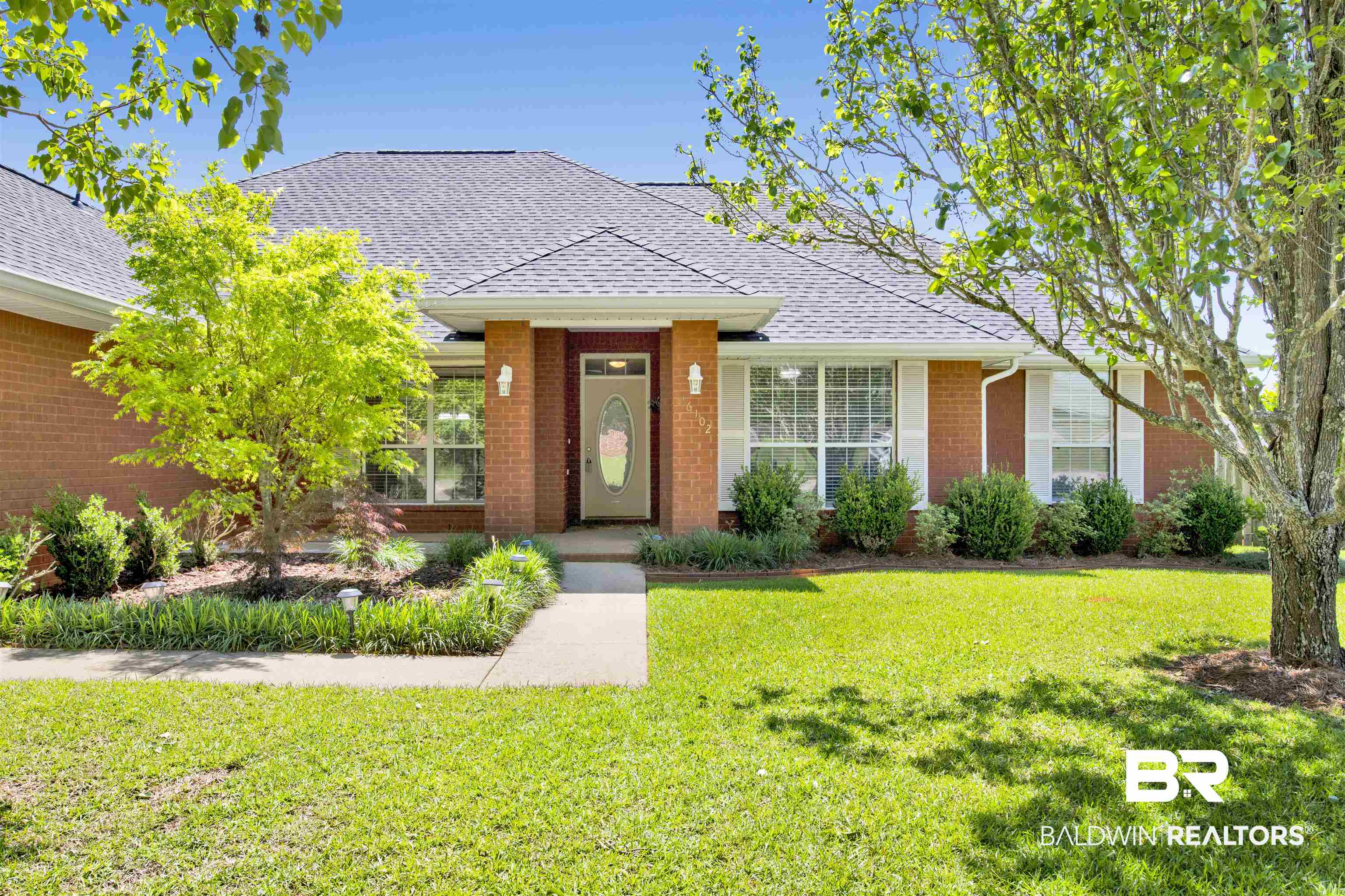16102 Masada Court Loxley, AL 36551 - Photo 1 of 35 View of front of property with brick siding, a front lawn, and a shingled roof